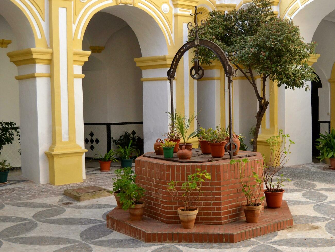 Stone well in the garden photo