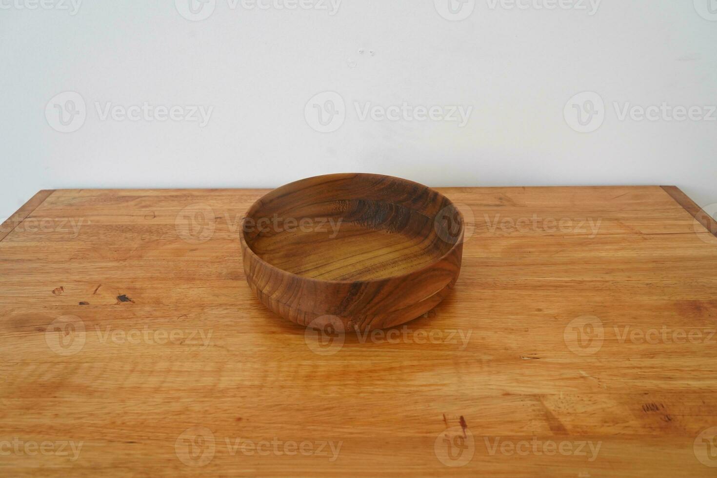 Wooden bowl on the table photo