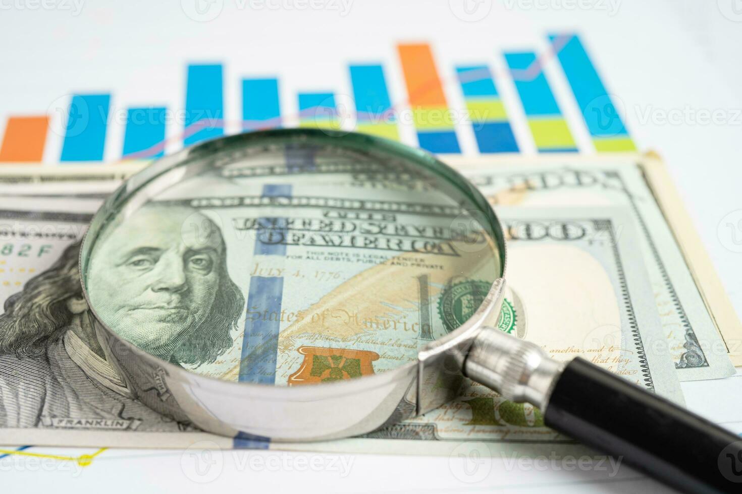 Magnifying glass on graph paper. Financial development, Banking Account, Statistics, Investment Analytic research data economy, Business concept. photo