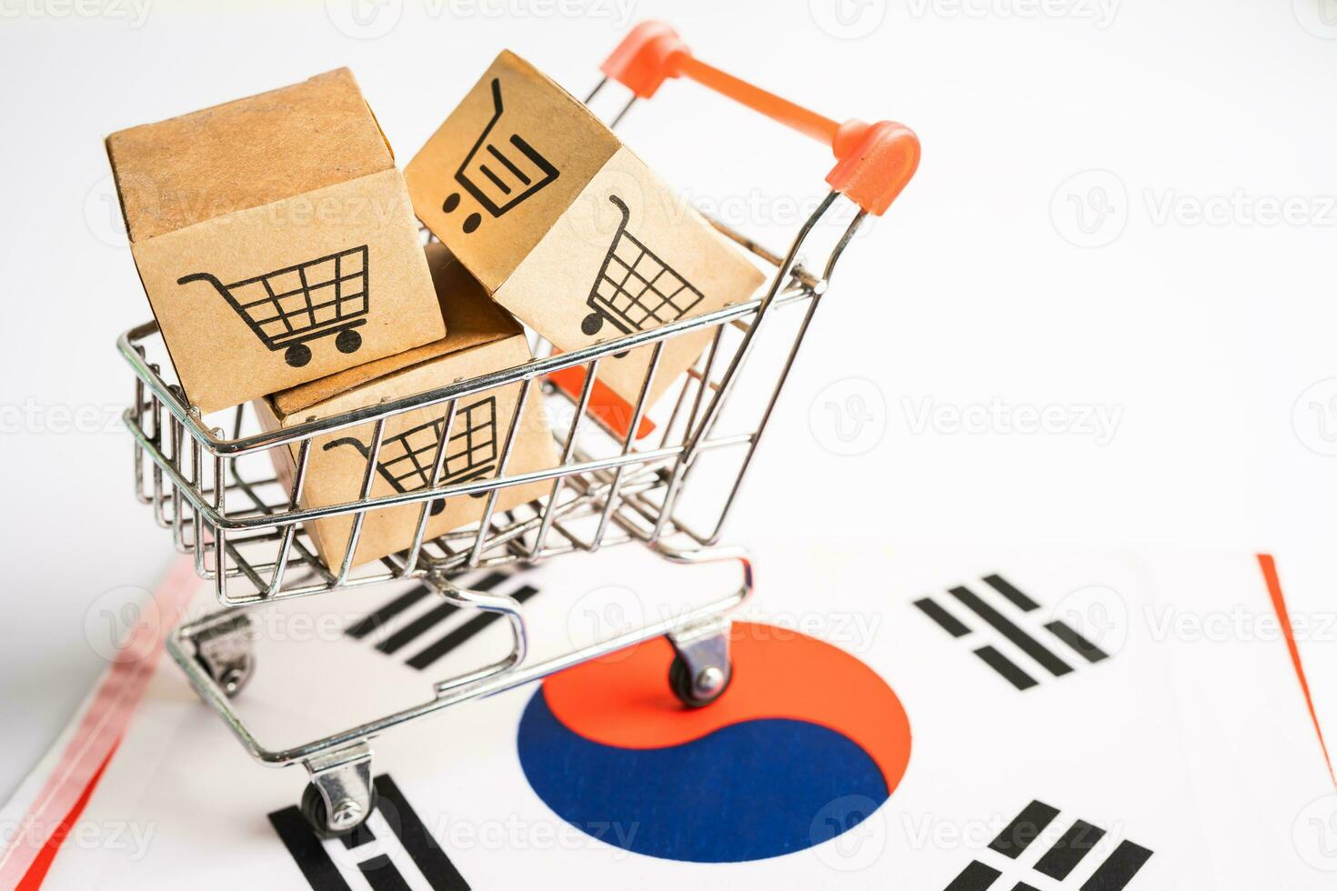 Box with shopping online cart logo and Korea flag, Import Export Shopping online or commerce finance delivery service store product shipping, trade, supplier concept. photo