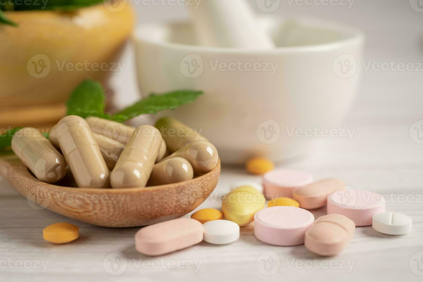 Alternative medicine herbal organic capsule with vitamin E omega 3 fish oil, mineral, drug with herbs leaf natural supplements for healthy good life. photo