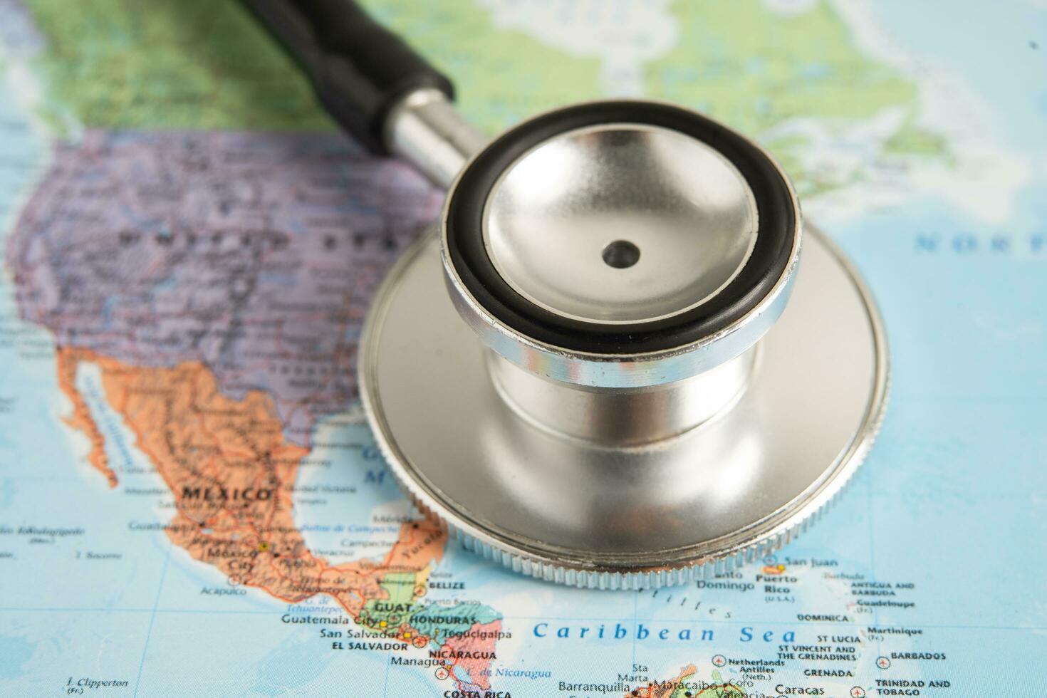 Bangkok, Thailand June 1, 2022, Stethoscope on United America world globe map background. photo