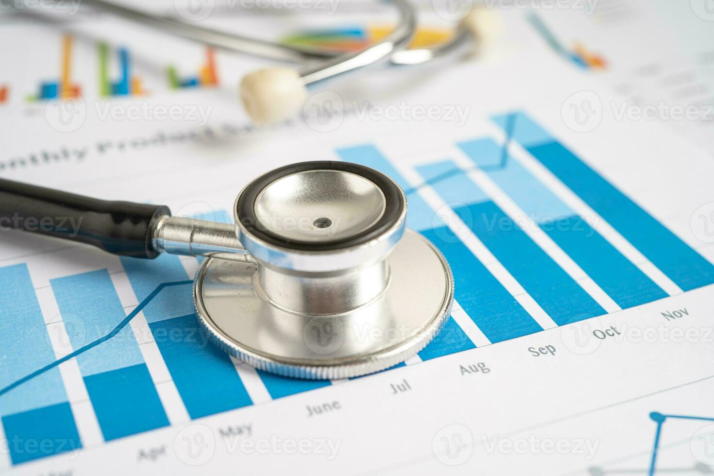 Stethoscope on graph paper, Finance, Account, Statistics, Investment, Analytic research data economy and Business company concept. photo