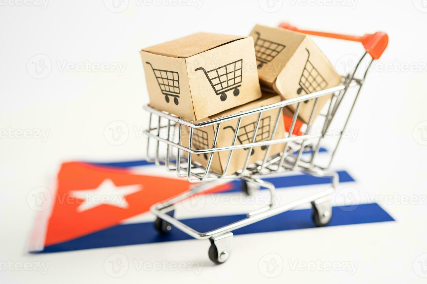 Box with shopping online cart logo and Cuba flag, Import Export Shopping online or commerce finance delivery service store product shipping, trade, supplier concept. photo