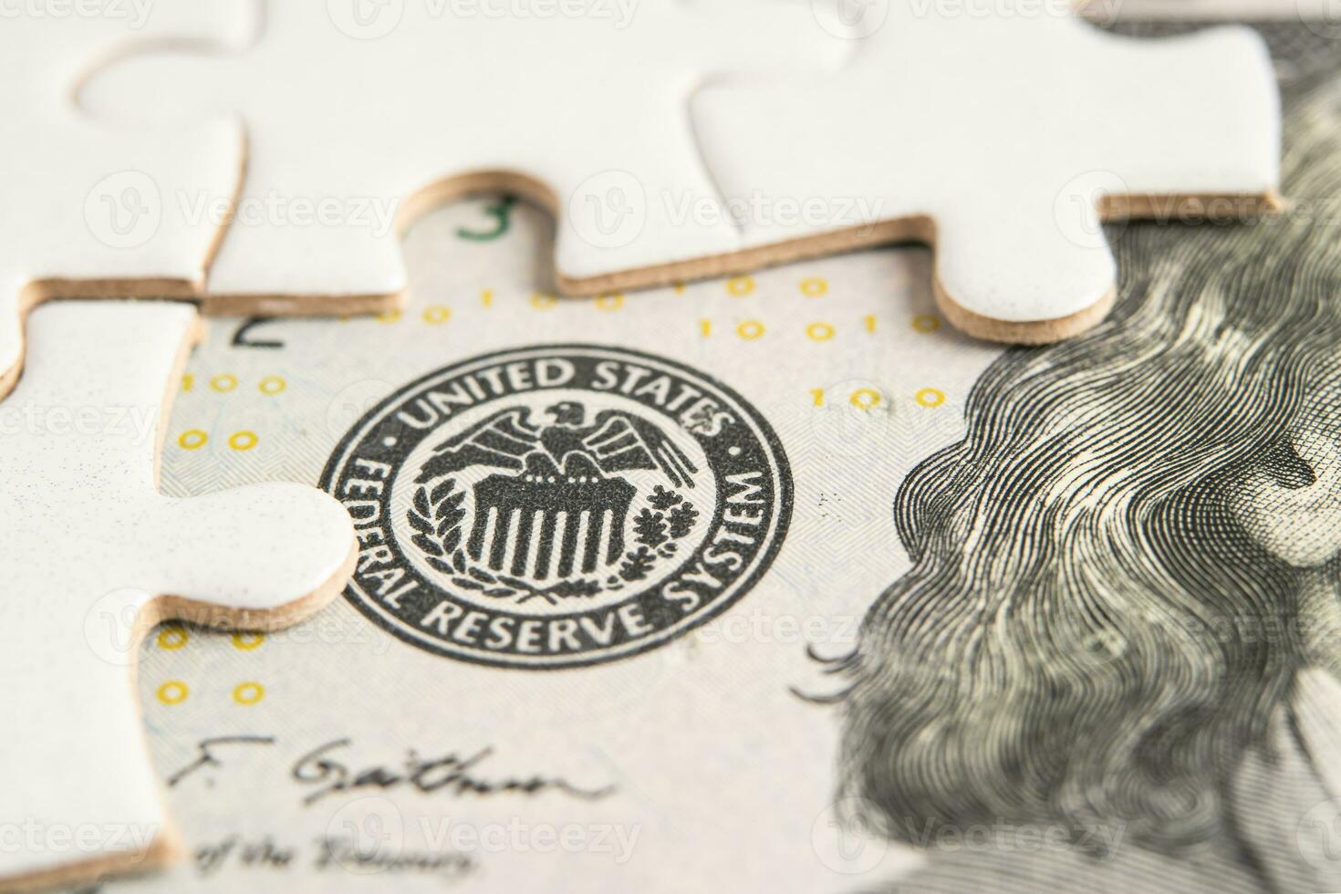 The Federal Reserve System with jigsaw puzzle paper, the central banking system of the United States of America. photo