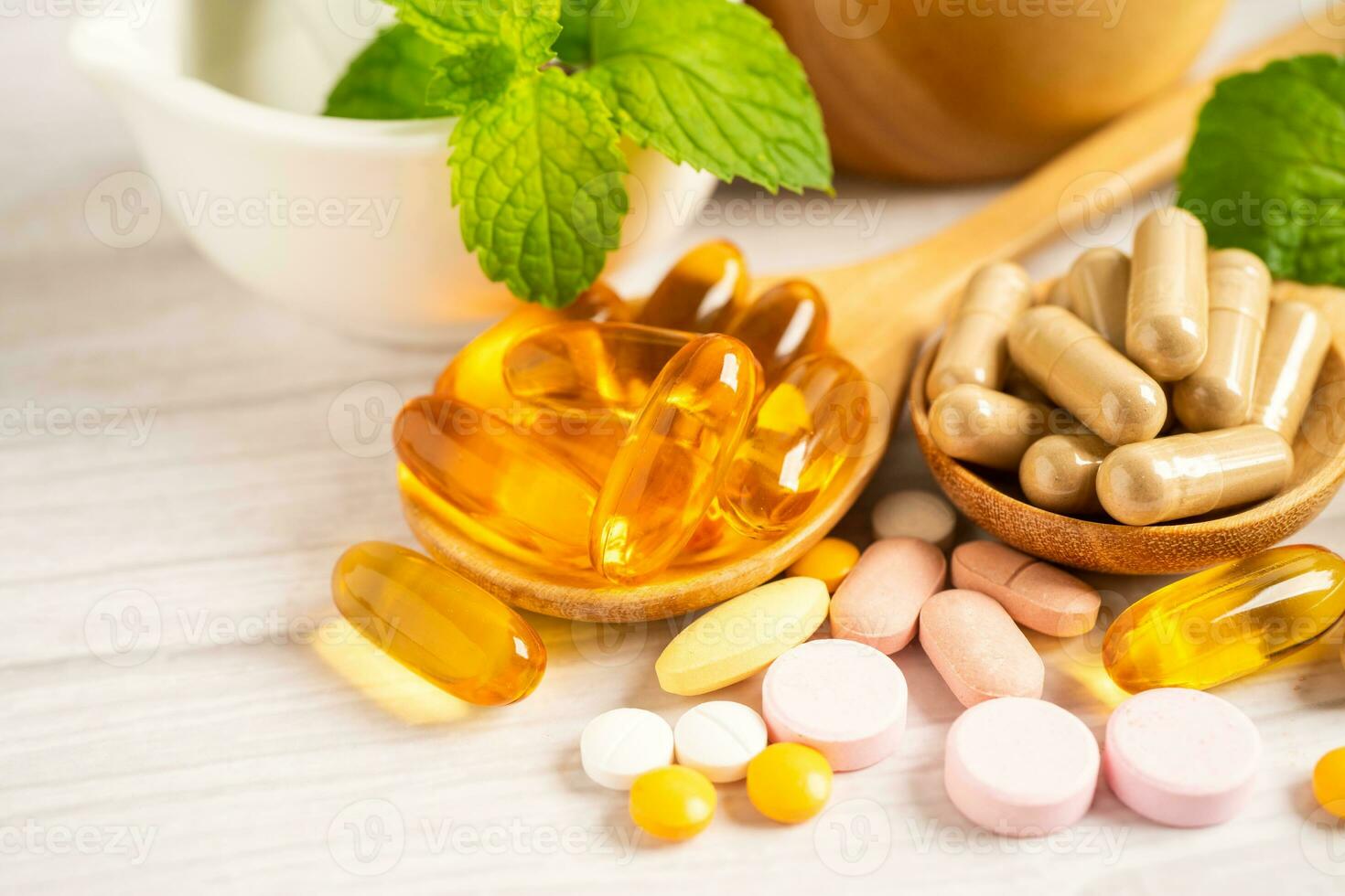 Alternative medicine herbal organic capsule with vitamin E omega 3 fish oil, mineral, drug with herbs leaf natural supplements for healthy good life. photo