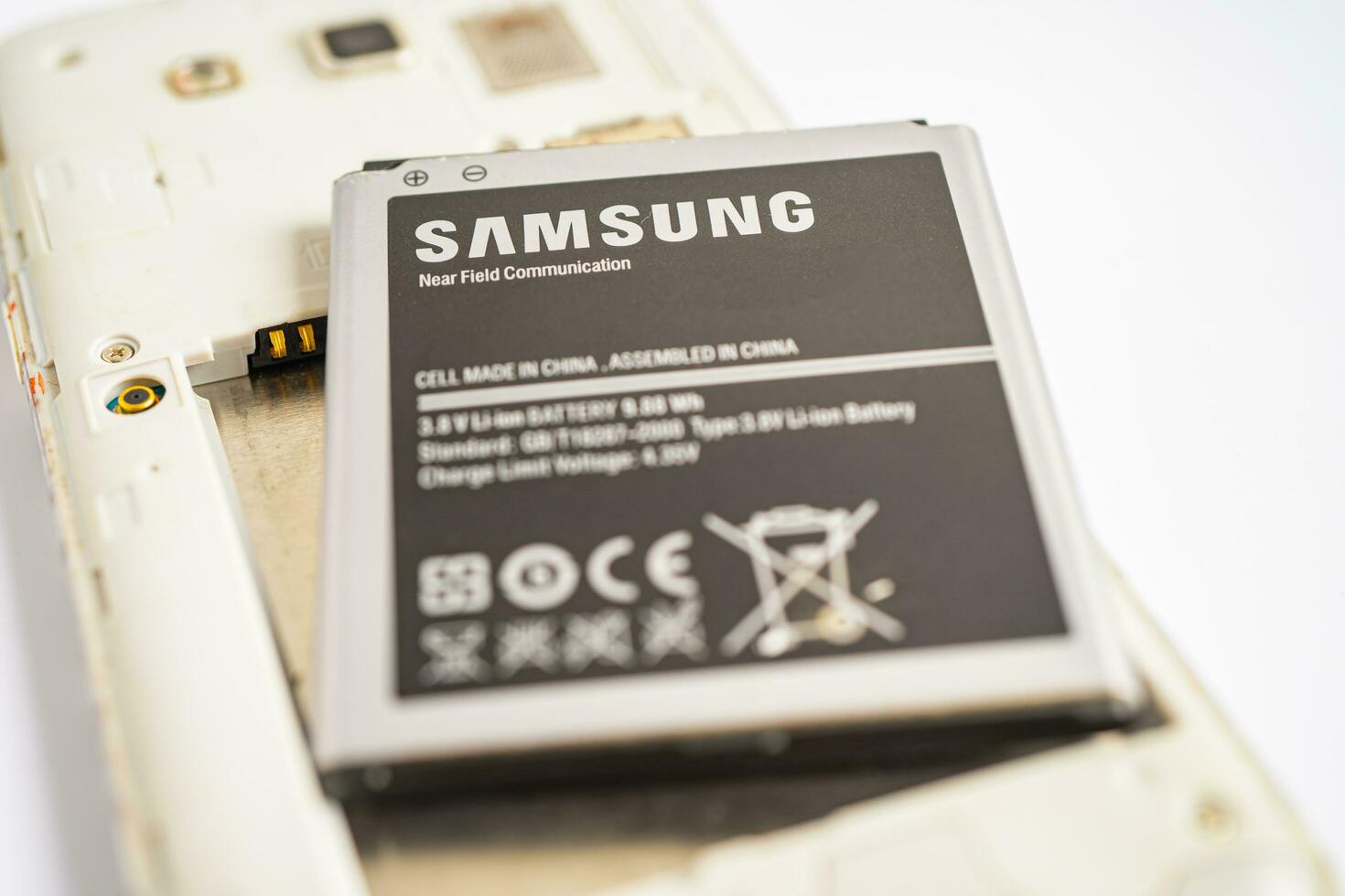 BANGKOK,THAILAND. MAY 1 2023 technician repairing and insert battery for Smartphone SAMSUNG. photo