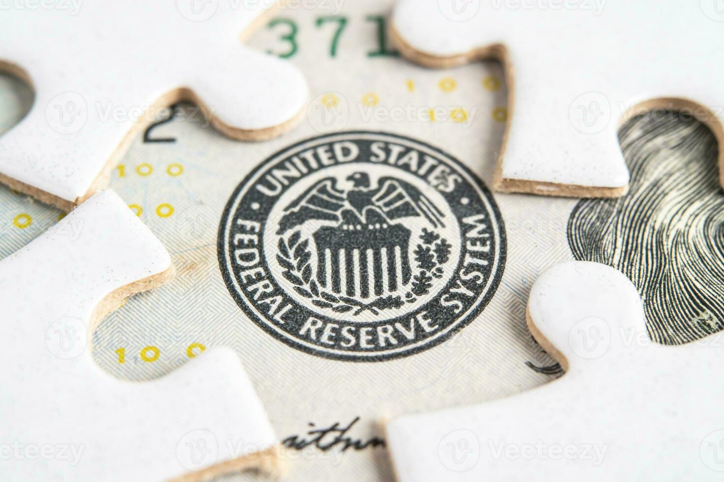 The Federal Reserve System with jigsaw puzzle paper, the central banking system of the United States of America. photo