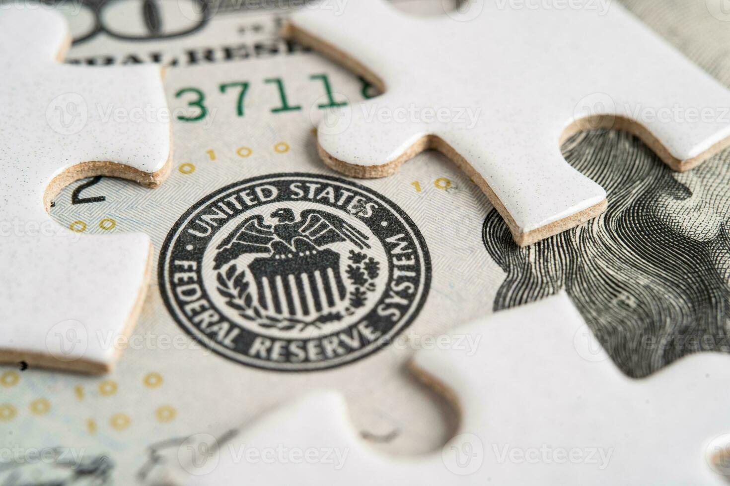 The Federal Reserve System with jigsaw puzzle paper, the central banking system of the United States of America. photo