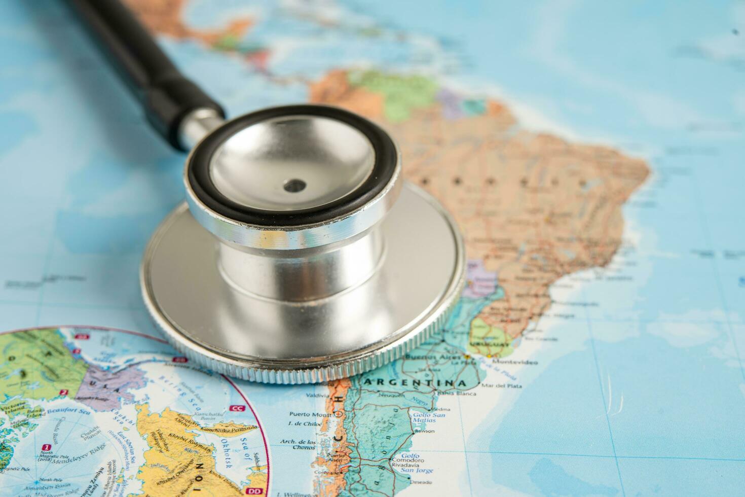 Bangkok, Thailand June 1, 2022, Stethoscope on South America world globe map background. photo