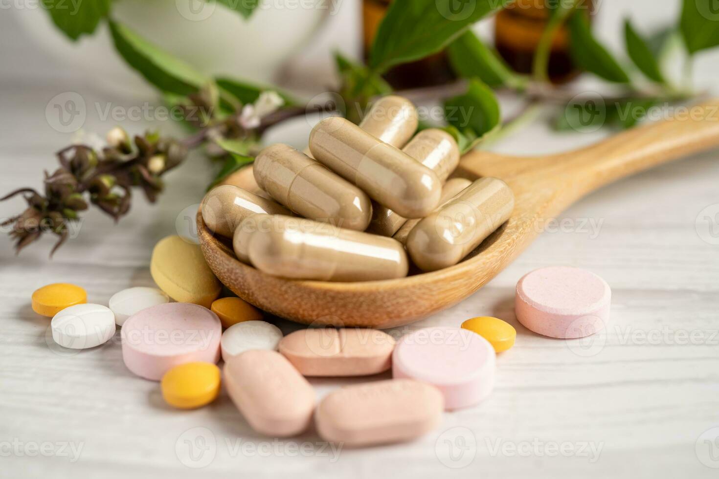 Alternative medicine herbal organic capsule with vitamin E omega 3 fish oil, mineral, drug with herbs leaf natural supplements for healthy good life. photo