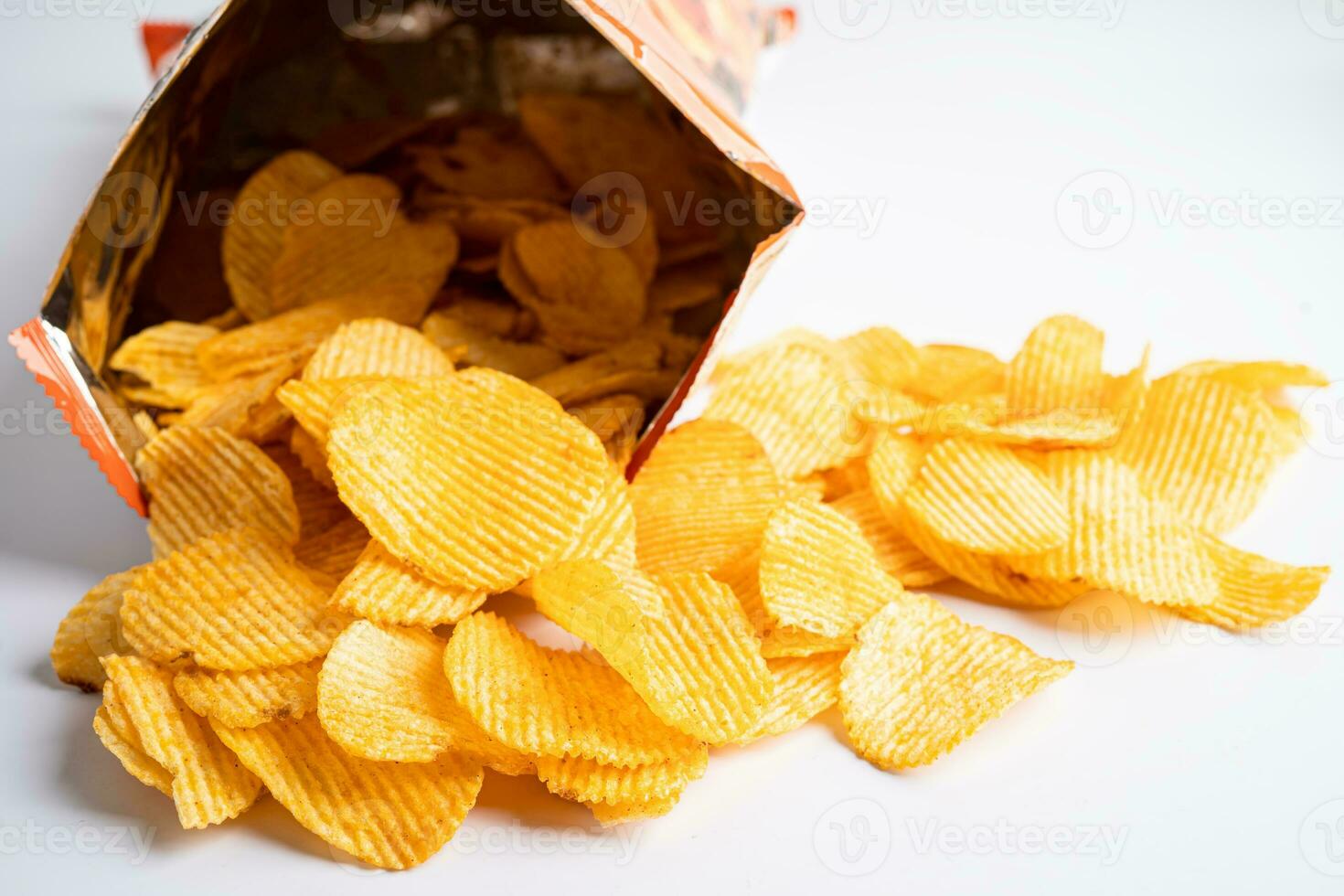 Potato chips, delicious BBQ seasoning spicy for crips, thin slice deep fried snack fast food in open bag. photo