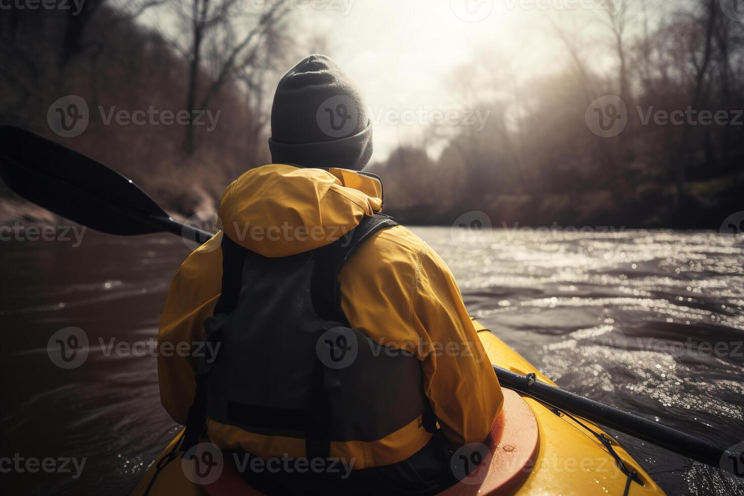 Kayaking, sports recreation, watersport. Rear view of man in yellow jacket and hat holding oars in boat on river. photo