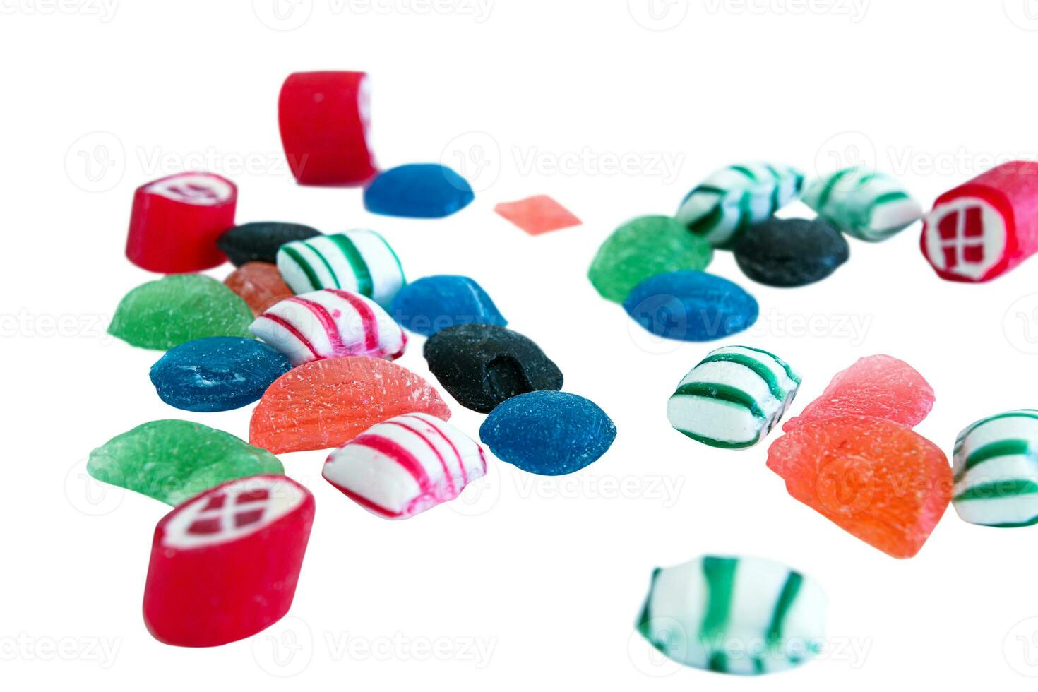 Close up of delicious candy spread out on white background photo