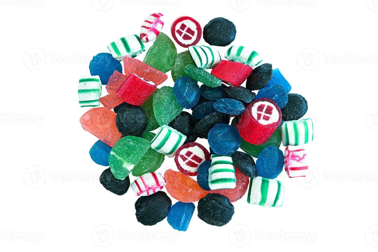 Pile of delicious candy spread out on white background overhead view photo