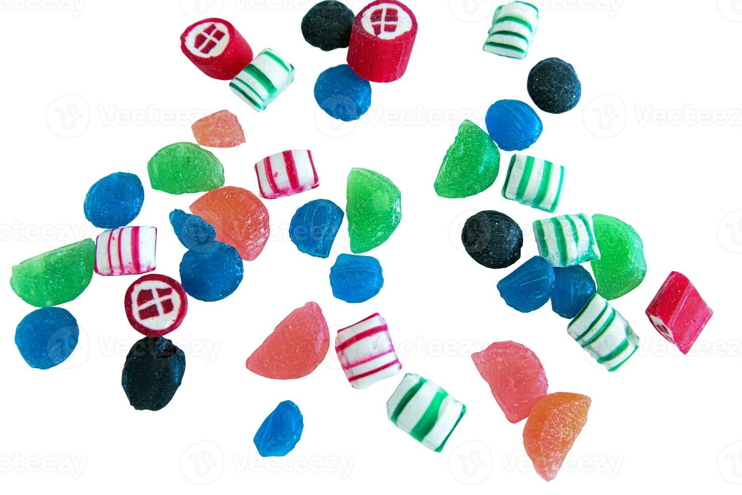 Close up of delicious candy spread out on white background photo