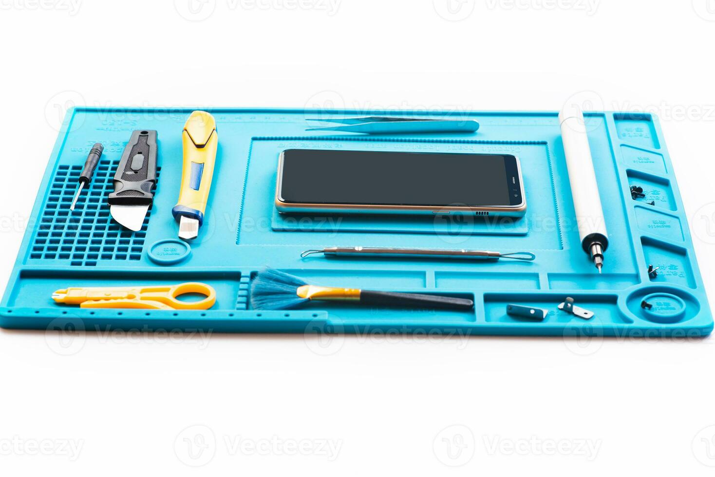 Flat lay image of dismantling the broken smart phone for preparing to repair or replace some components, Top view photo