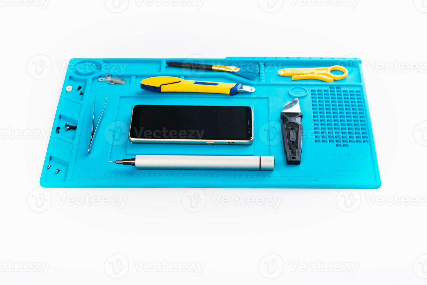 Flat lay image of dismantling the broken smart phone for preparing to repair or replace some components, Top view photo