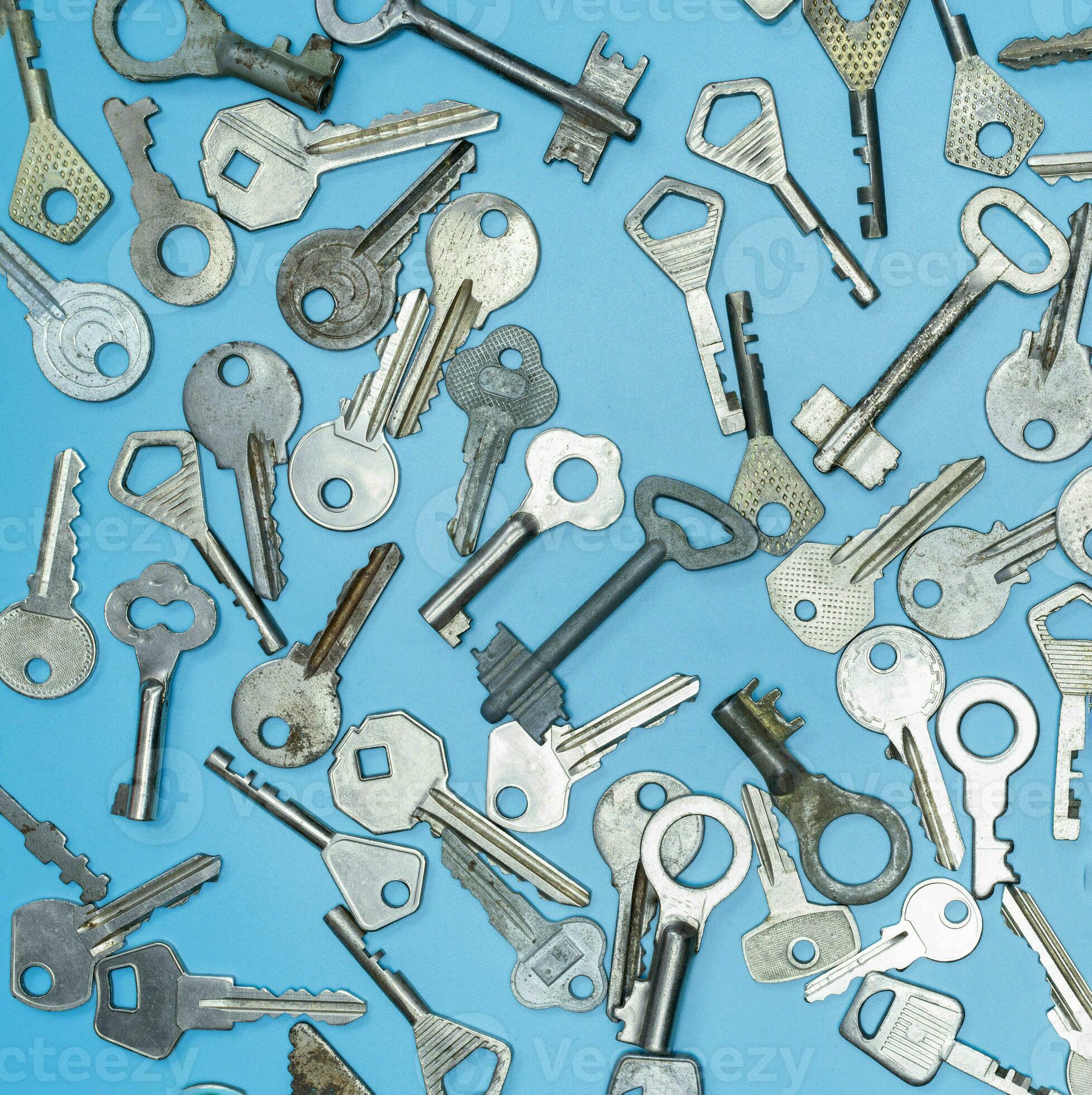 Keys set on blue background. Door lock keys and safes for property security and house protection