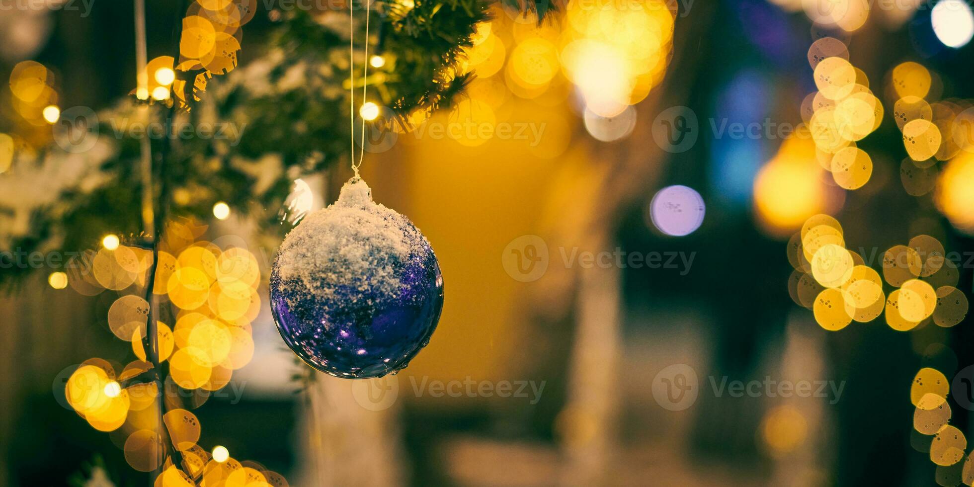 Christmas tree decorations covered snow, outdoor xmas tree with decorative blue bulbs photo