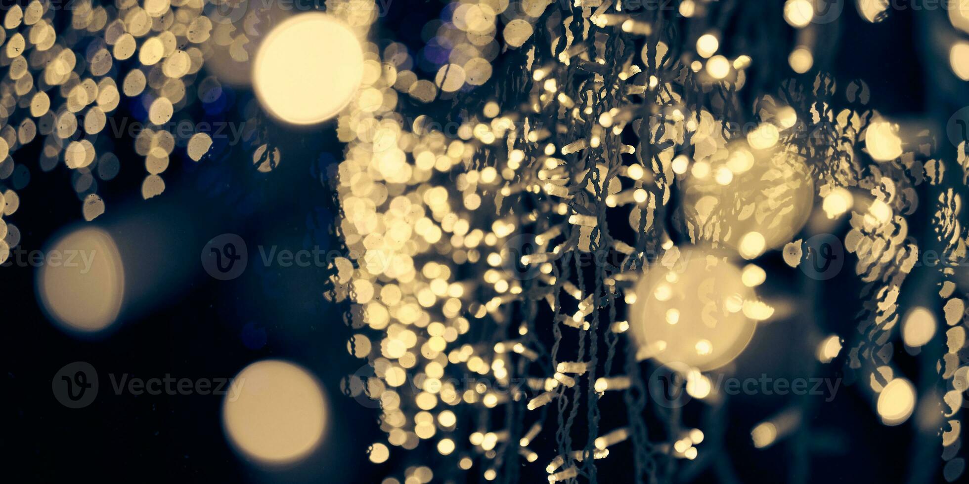 luces amarillas pálidas bokeh de guirnaldas navideñas, luces de fondo abstractas festivas borrosas foto