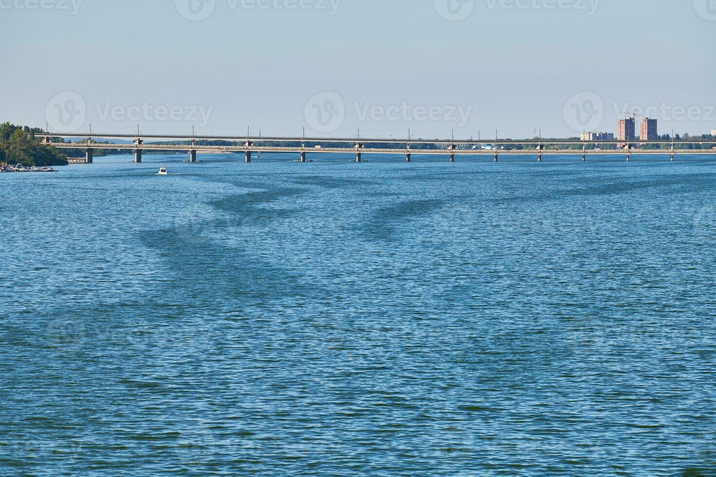 Wide river and bridge over. photo