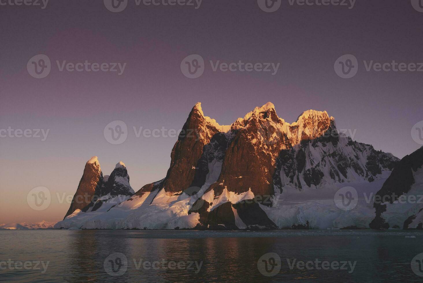 Lemaire strait coastal landscape, mountains and icebergs, Antarctic Peninsula, Antartica. photo