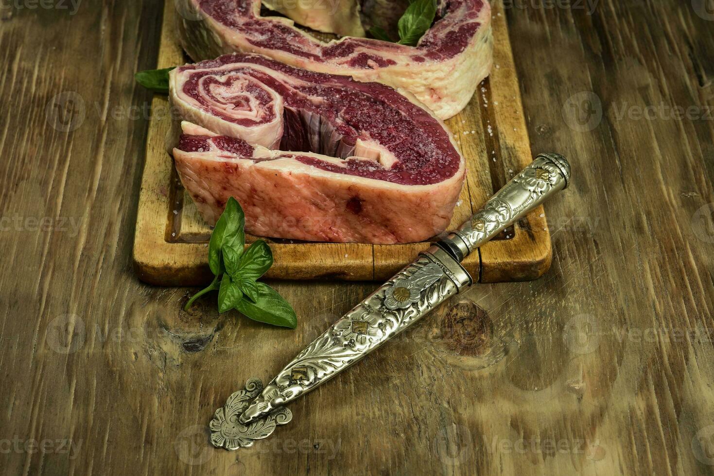 Beef ribs ready for roasting, prepared on the wooden table, traditional Argentine food. photo