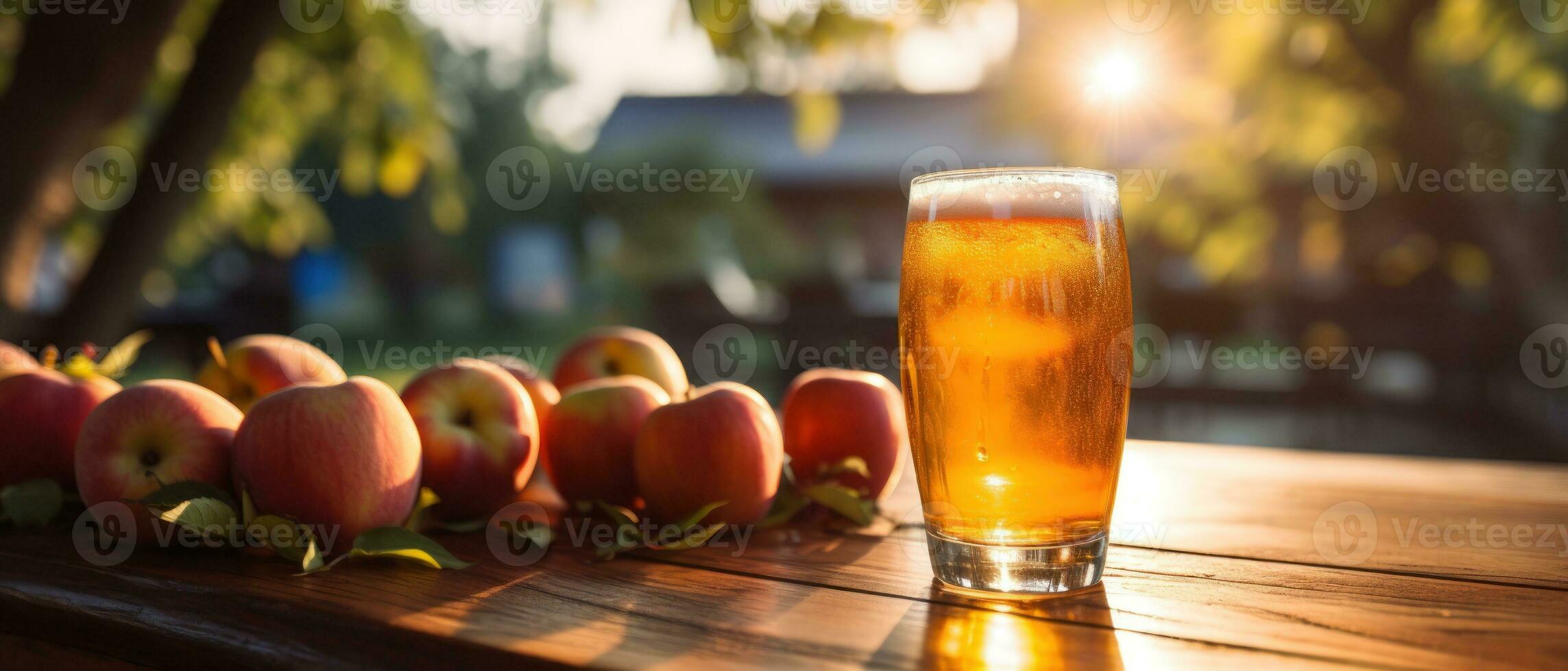 Apple cider on table with apples photo