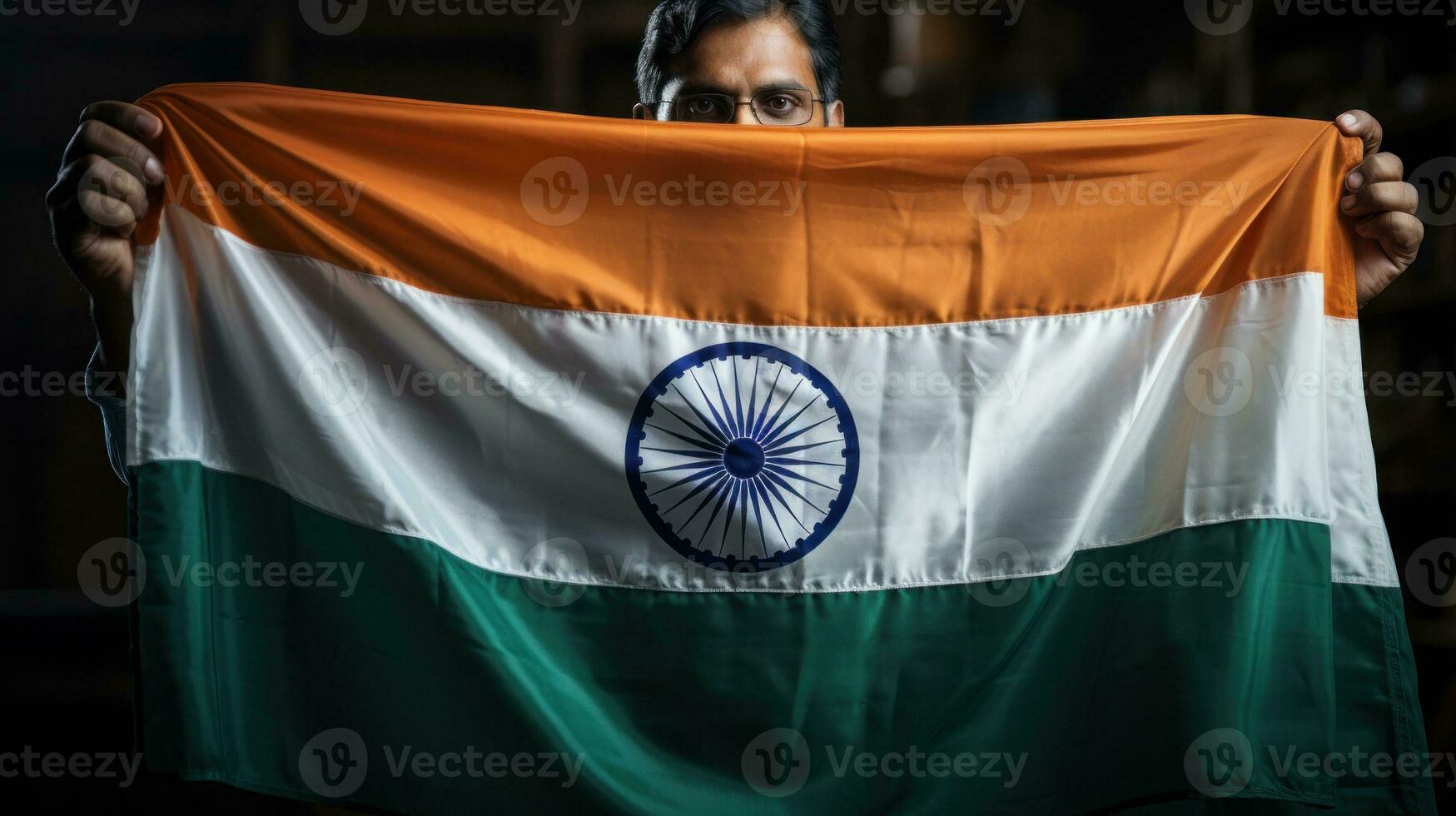 Hand holding India flag photo