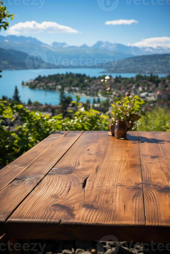 Wood table on close up lake blur on the background. Natural afternoon sunlight. photo