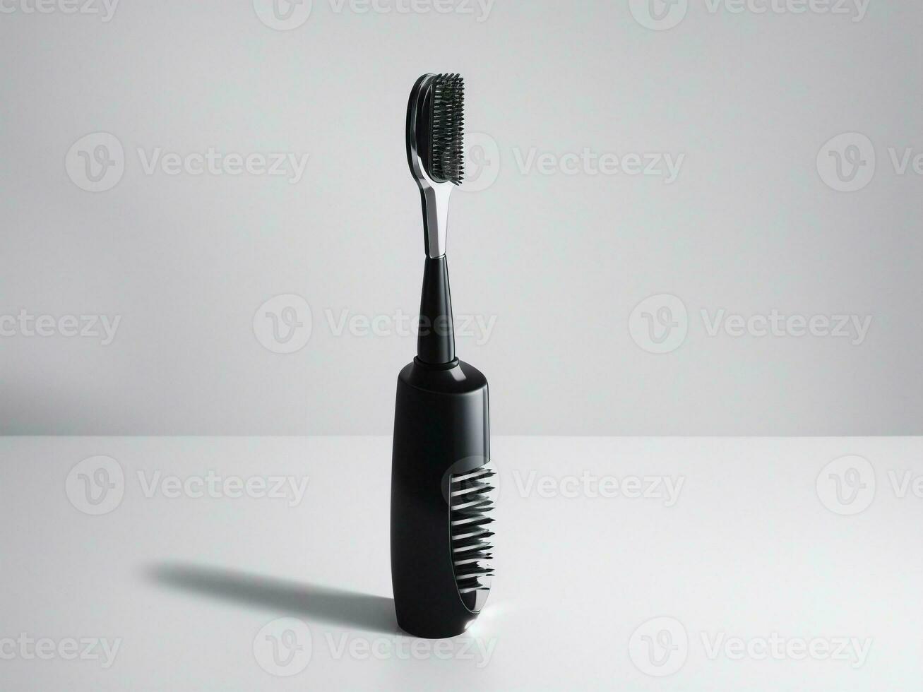 small black toothbrush on a white background photo