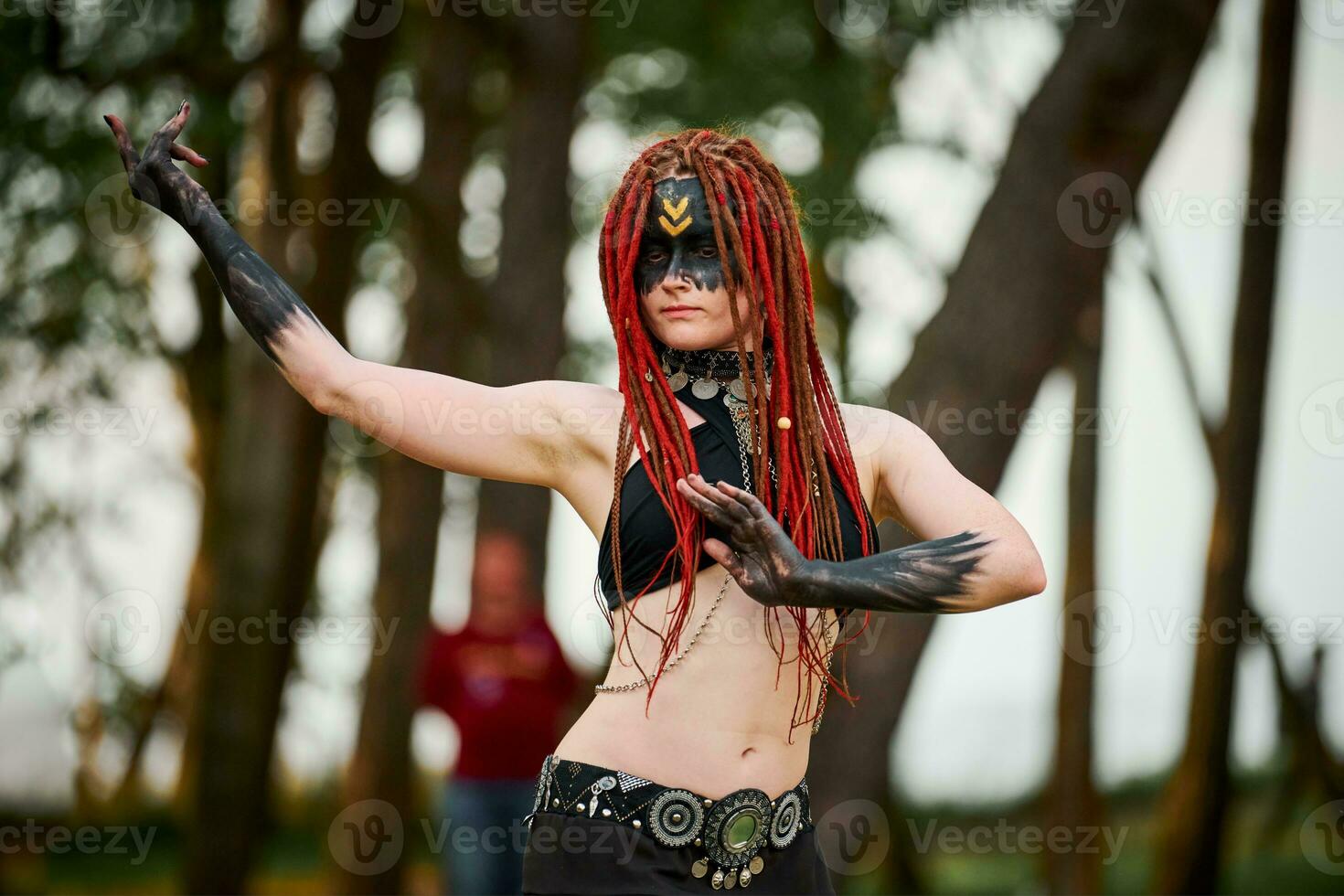 Mythological dancing girl faun on green lawn in public park outdoor art dancing event photo