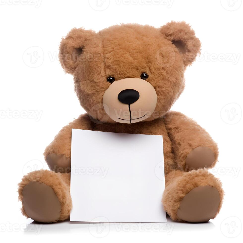 Brown Teddy Bear sitting on a White Background with a Blank Piece photo