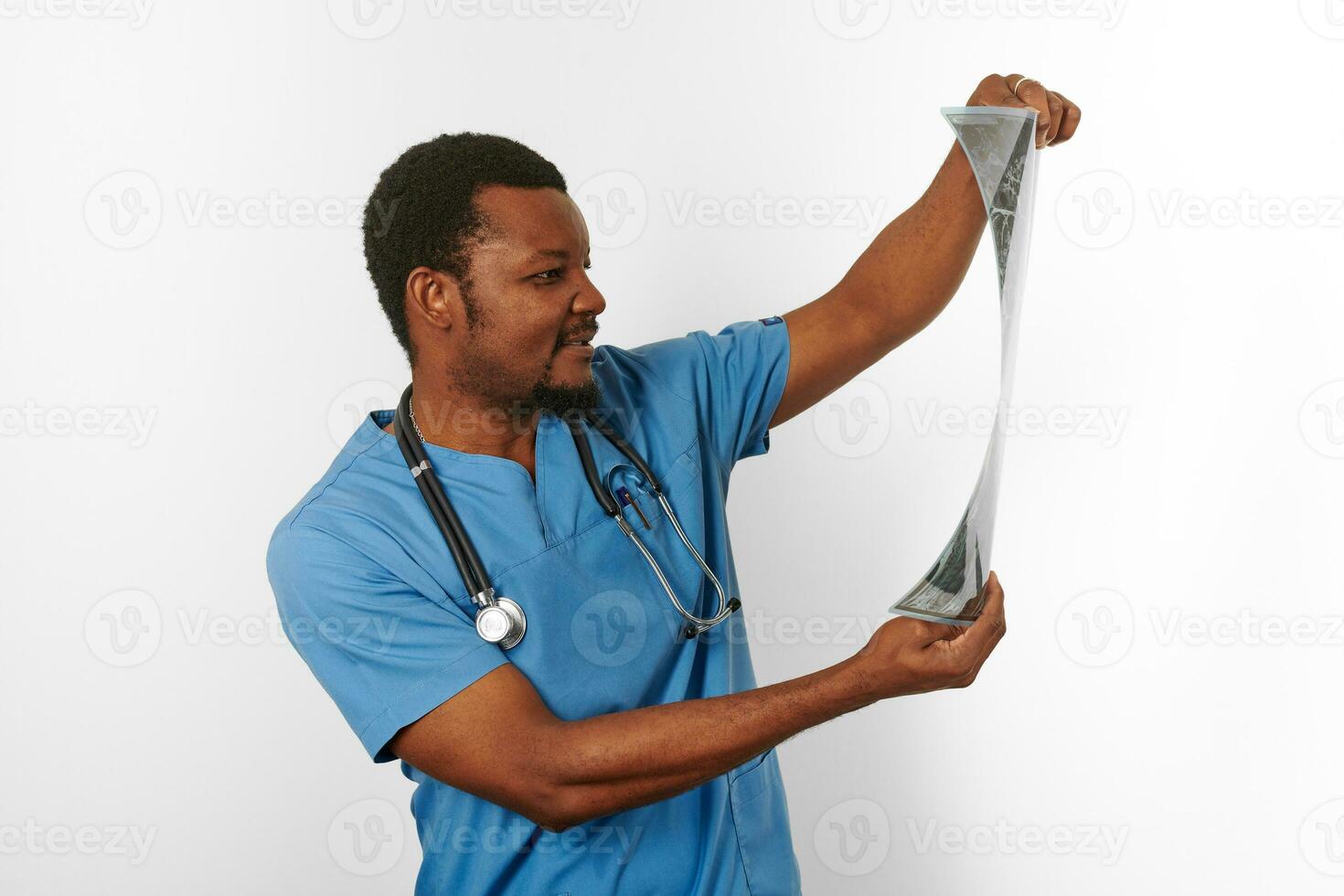 Black surgeon doctor bearded man in blue coat with crossed arms isolated white background copy space photo