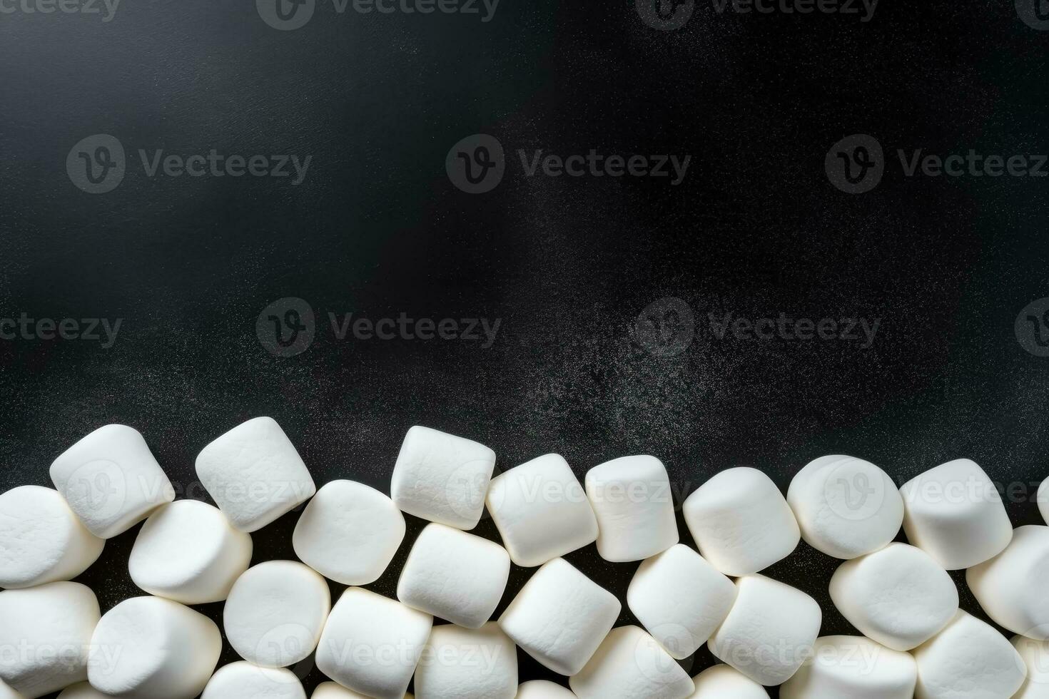 Delicious marshmallows dark background with empty space for text photo