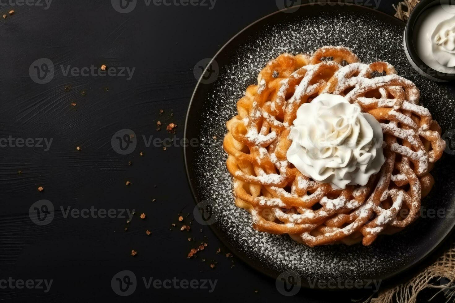 Delicious Funnel Cake dark background with empty space for text photo