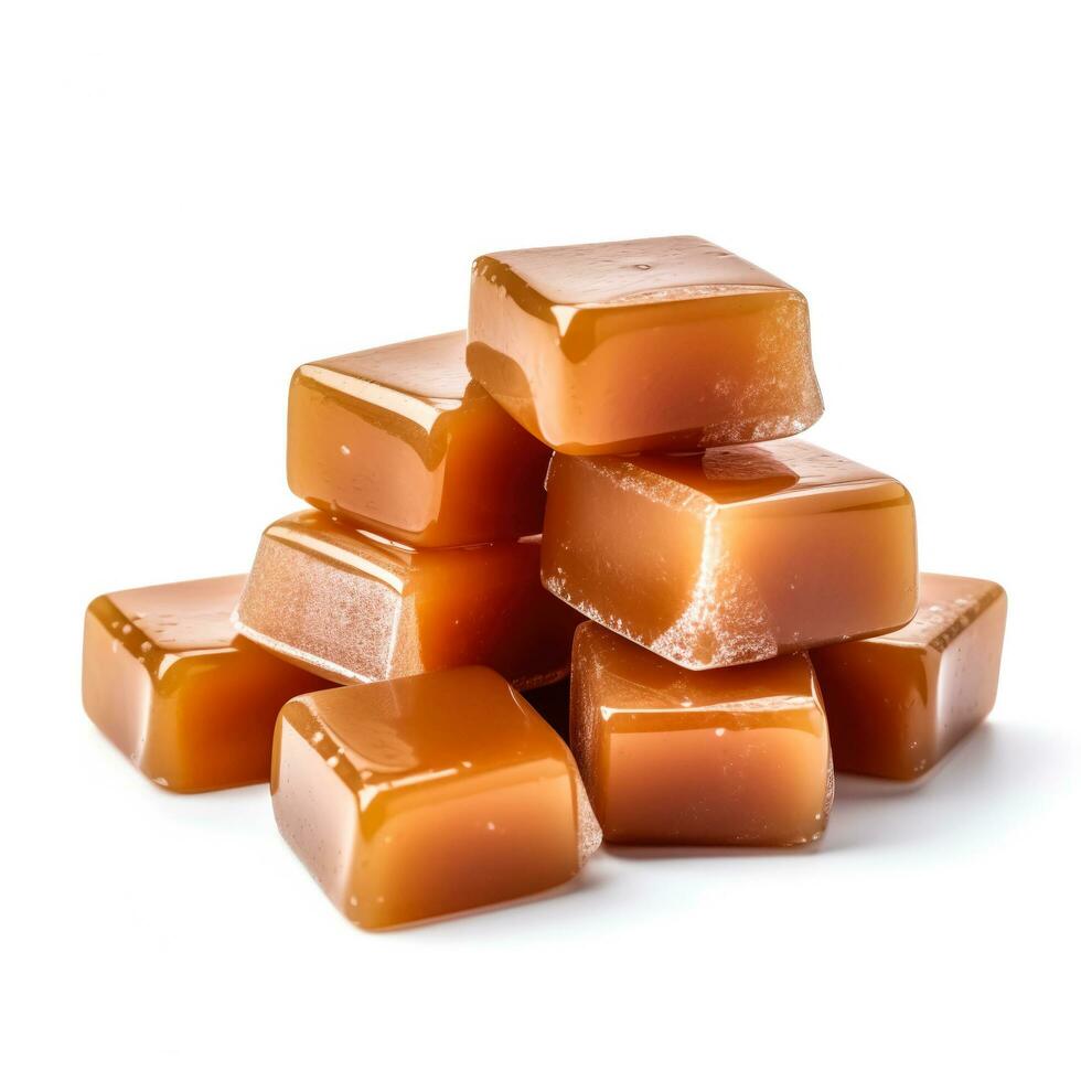 Delicious caramels isolated on white background photo