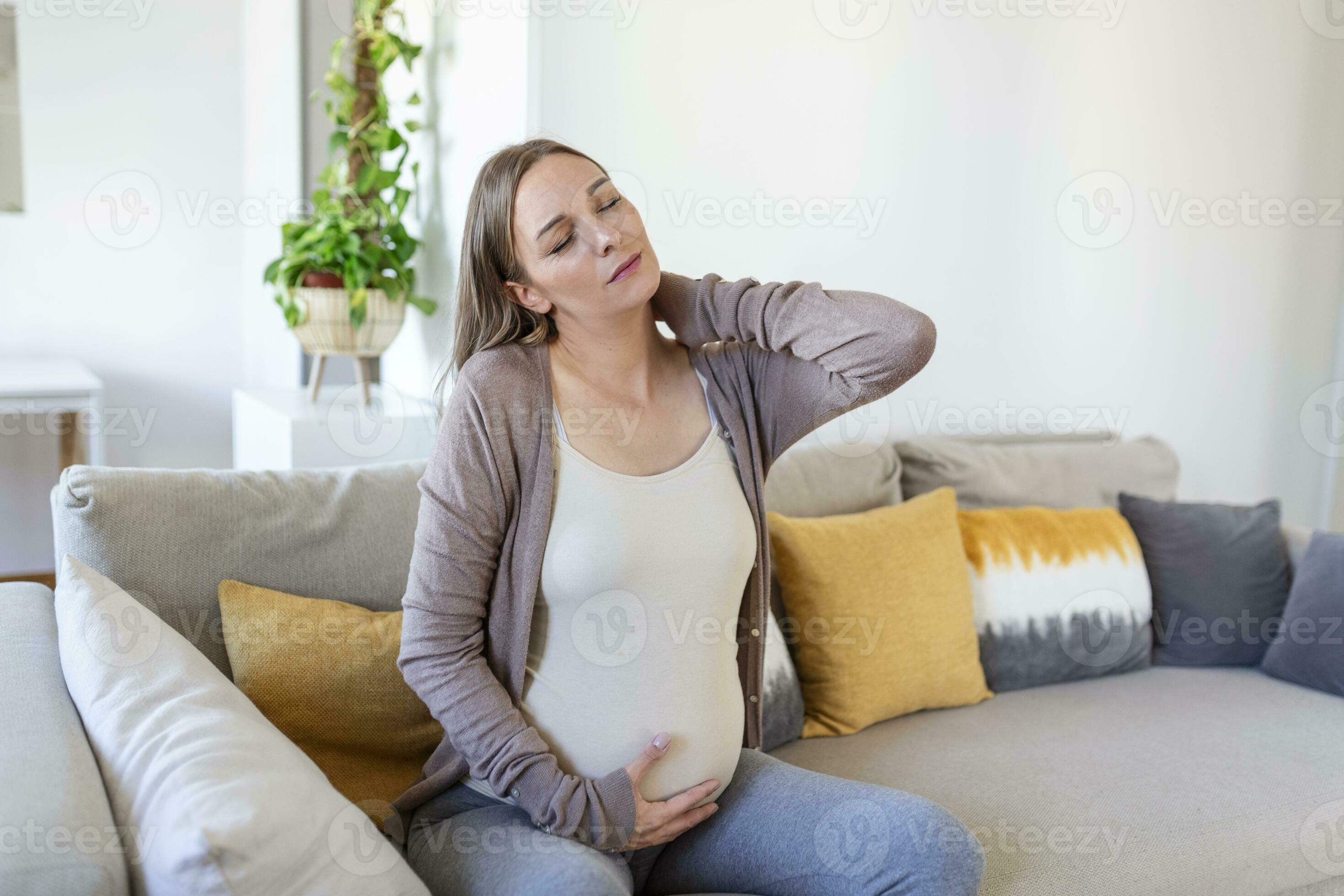 pregnant woman suffer nrck and shoulder pain. pregnant woman holding