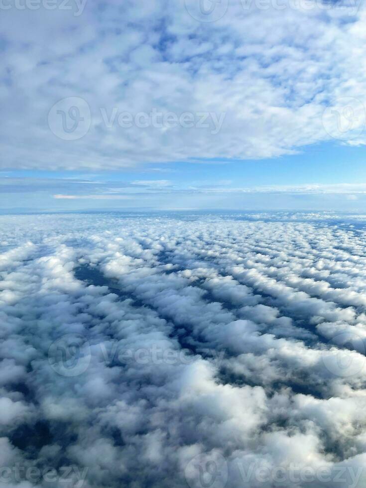 Cloudy sky, view from the airplane window photo