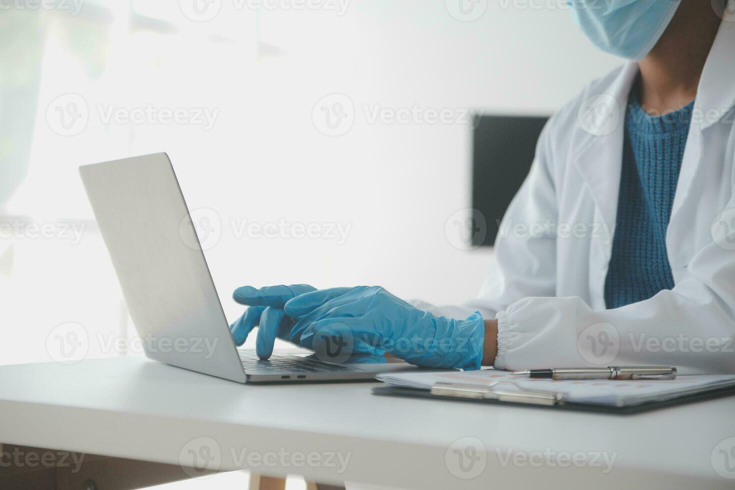 Professional lab. Amazing longhaired medical worker wearing uniform while using microscope during research photo