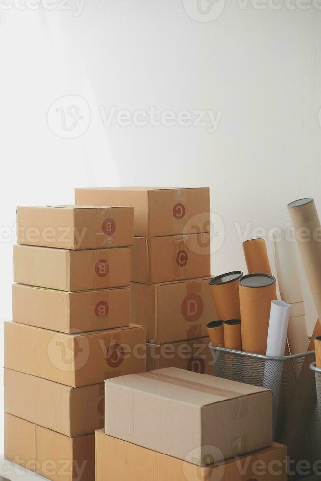 Business woman start up small business entrepreneur SME success .freelance woman working at home with Online Parcel delivery. SME and packaging deliveryconcept photo