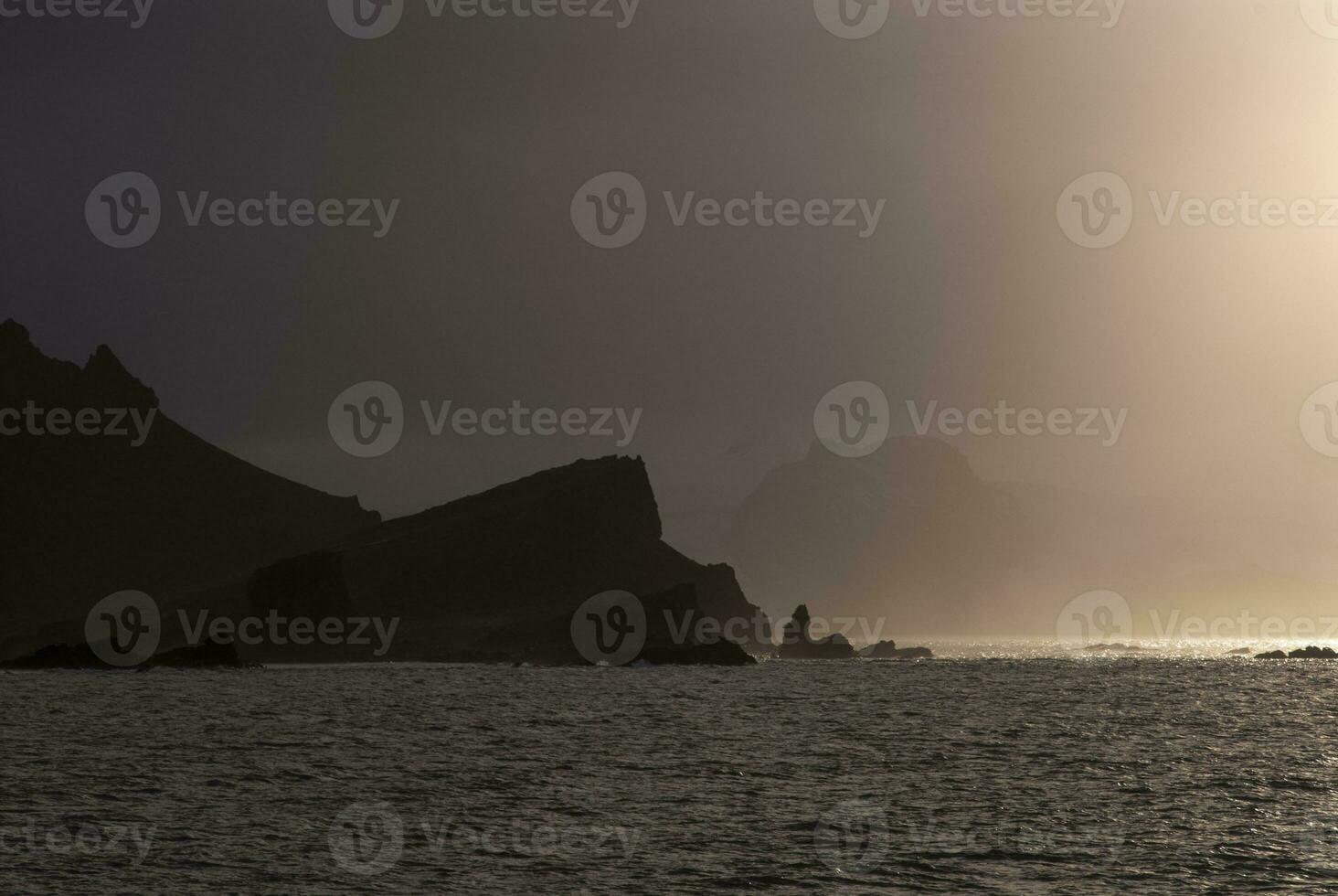 Sunset over Antarctica sea photo