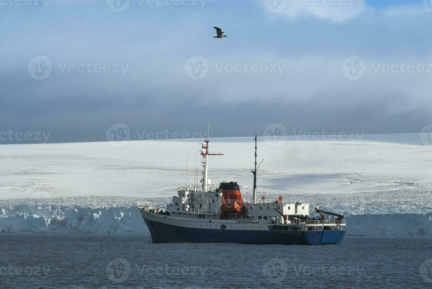 Expedition ship, cruise in Antarctic landscape, Paulet island, near the Antarctic Peninsula photo