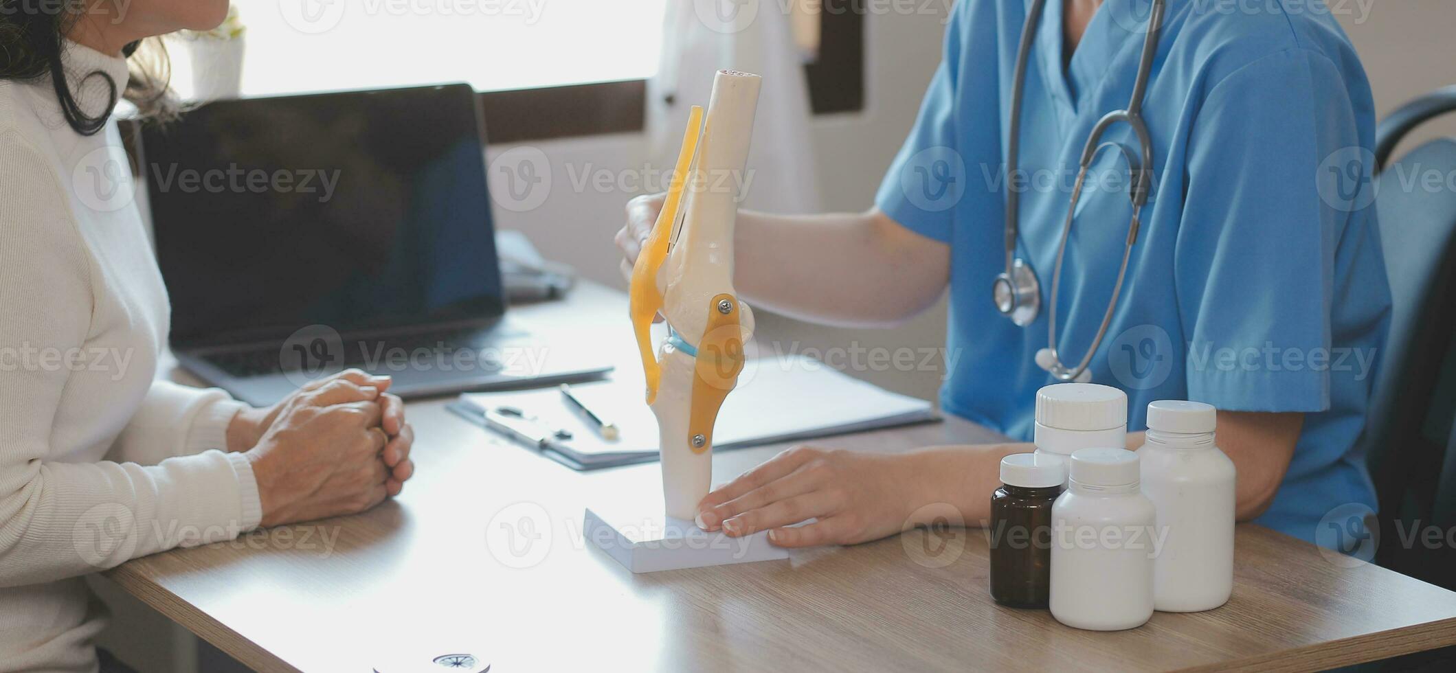 Asian doctor woman visited patient woman to diagnosis and check up health at home or private hospital. Female patient explain health problem and symptoms to doctor .Health care premium service at home photo