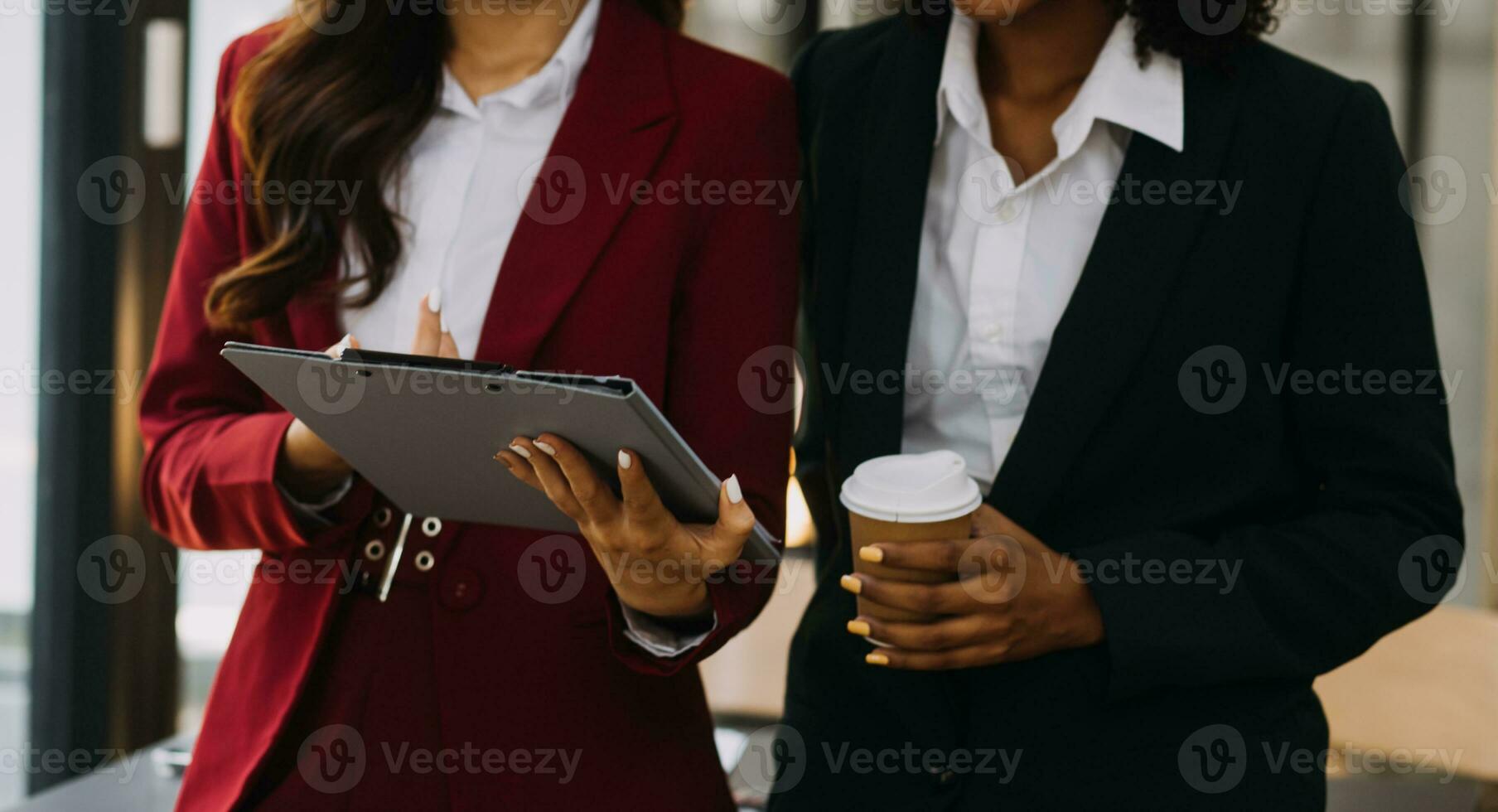 Asian Business woman using calculator and laptop for doing math finance on an office desk, tax, report, accounting, statistics, and analytical research concept photo