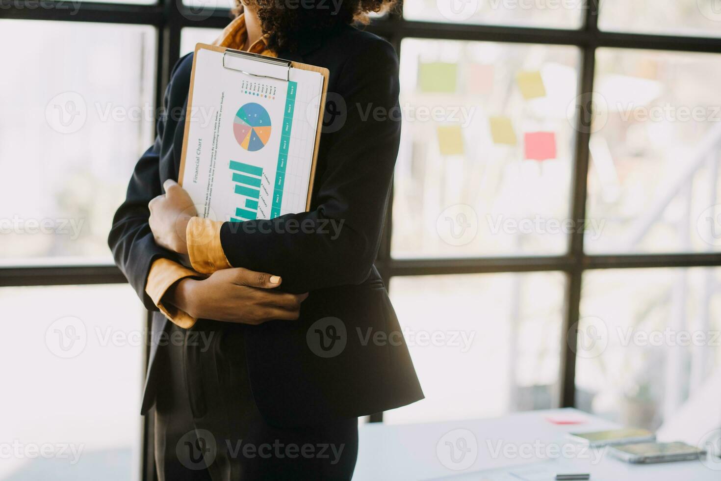 Asian Business woman using calculator and laptop for doing math finance on an office desk, tax, report, accounting, statistics, and analytical research concept photo