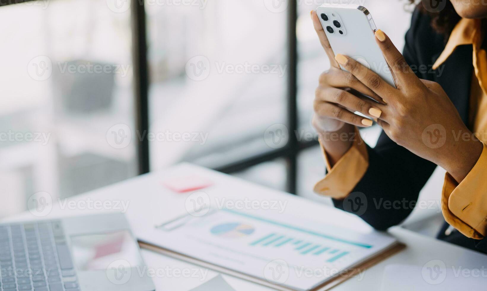 Asian Business woman using calculator and laptop for doing math finance on an office desk, tax, report, accounting, statistics, and analytical research concept photo