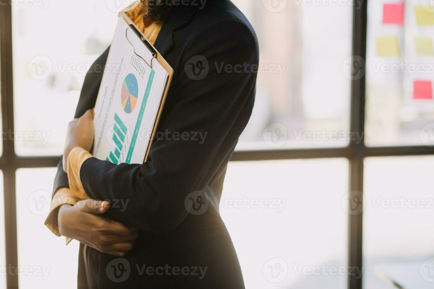 Asian Business woman using calculator and laptop for doing math finance on an office desk, tax, report, accounting, statistics, and analytical research concept photo