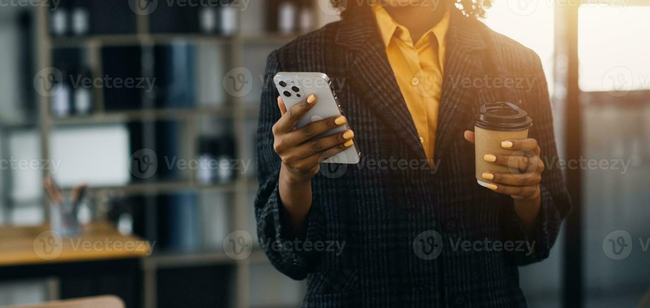 Asian Business woman using calculator and laptop for doing math finance on an office desk, tax, report, accounting, statistics, and analytical research concept photo